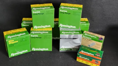Collection of 12-gauge Remington ammunition boxes, including Express Long Range, Nitro Magnum, Nitro-Steel, Nitro Turkey, and Premier...