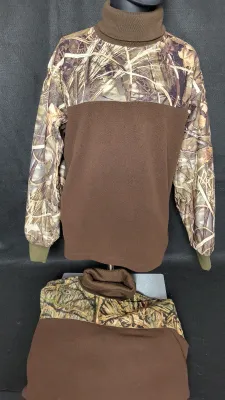 Two camouflage and brown fleece turtleneck hunting shirts displayed on a mannequin and surface.