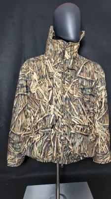 Mossy Oak heavy camouflage hunting jacket with high collar and multiple cargo pockets, displayed on a mannequin.