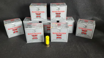 Collection of nine Winchester Super X lead shot high brass game load shotgun shell boxes, featuring 20 gauge shells alongside a single...