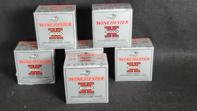 Six vintage boxes of Winchester Super-X 16-gauge lead shot high brass game loads shotgun ammunition.