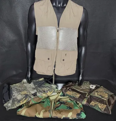 Collection of men's hunting and shooting vests, featuring a tan Browning mesh-back vest displayed on a mannequin and three...