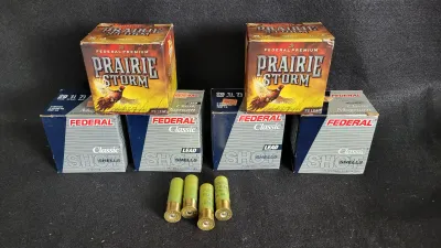 Collection of six Federal brand shotgun shell boxes, including Prairie Storm and Classic Lead loads, with four 20-gauge yellow shells...