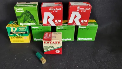 Assortment of vintage and modern shotgun shell boxes, including Remington Express Long Range, Rio Game Load, and Estate Cartridge target...