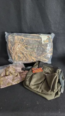Ducks Unlimited hunting gear set, including a new-in-plastic camo Avery cooler bag, an olive green tote bag, and a camo beanie.