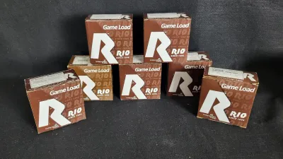 Seven boxes of Rio Game Load 12-gauge hunting shotgun cartridges.