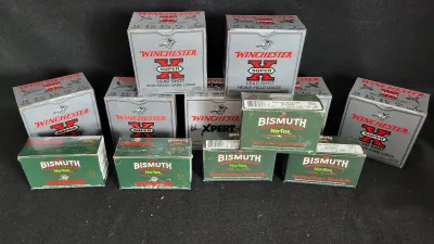 Assortment of vintage shotgun ammunition boxes, including Winchester Super-X lead shot game loads and Bismuth Cartridge Company No-Tox...