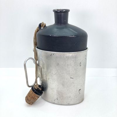 LOT 524: Vintage Military Collection - Survival Kit Plastic Rations Flask, Canteen, Pewter Eagle Figurine and More