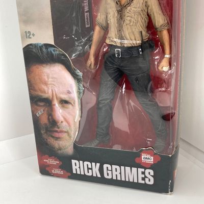 LOT 532: Classic Entertainment Collection - "Rick Grimes" Figurine in Original Box, VHS Disney's The Little Mermaid Movie,...