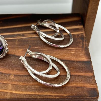 LOT 529: Large Collection of Silver Tone Jewelry - Earrings, Necklaces (Locket with Paper Scroll) and Fashion Watches