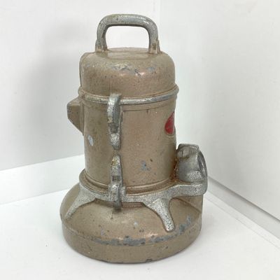 LOT 531: Vintage Coin Bank Collection - Tin Litho Rotary Sorter, Ceramic Cabin, Tin Litho Rotary Sorter, Rexair Vacuum and Piggy Bank