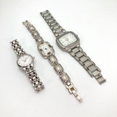LOT 529: Large Collection of Silver Tone Jewelry - Earrings, Necklaces (Locket with Paper Scroll) and Fashion Watches