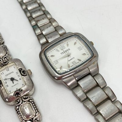 LOT 529: Large Collection of Silver Tone Jewelry - Earrings, Necklaces (Locket with Paper Scroll) and Fashion Watches