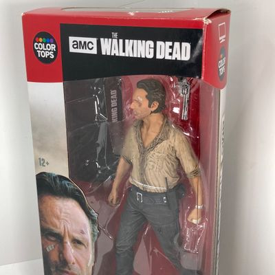 LOT 532: Classic Entertainment Collection - "Rick Grimes" Figurine in Original Box, VHS Disney's The Little Mermaid Movie,...