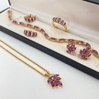 LOT 32: Gold Tone and Purple Stone Jewelry Set - Necklace 18", Ring, Bracelet and Two Pairs of Earrings