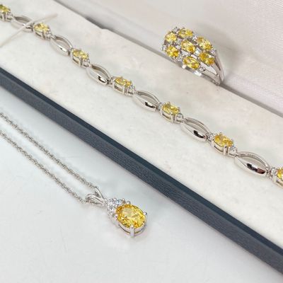LOT 41: Sterling Silver Jewelry - Yellow Stone Necklace, Ring and Bracelet Set 18.5 GTW with Blue Stone Bezel Watch with 925 Accents on Band
