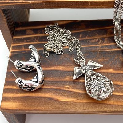 LOT 529: Large Collection of Silver Tone Jewelry - Earrings, Necklaces (Locket with Paper Scroll) and Fashion Watches