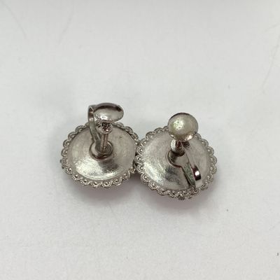 LOT 529: Large Collection of Silver Tone Jewelry - Earrings, Necklaces (Locket with Paper Scroll) and Fashion Watches