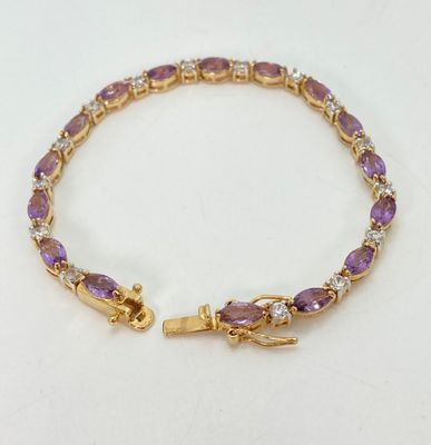 LOT 32: Gold Tone and Purple Stone Jewelry Set - Necklace 18", Ring, Bracelet and Two Pairs of Earrings