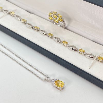 LOT 41: Sterling Silver Jewelry - Yellow Stone Necklace, Ring and Bracelet Set 18.5 GTW with Blue Stone Bezel Watch with 925 Accents on Band