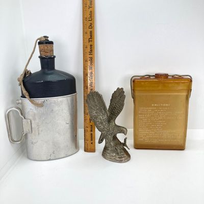 LOT 524: Vintage Military Collection - Survival Kit Plastic Rations Flask, Canteen, Pewter Eagle Figurine and More