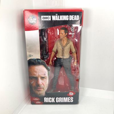 LOT 532: Classic Entertainment Collection - "Rick Grimes" Figurine in Original Box, VHS Disney's The Little Mermaid Movie,...