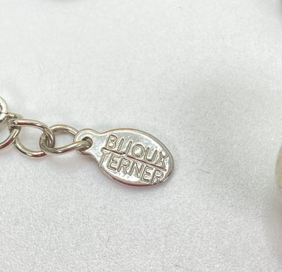 LOT 529: Large Collection of Silver Tone Jewelry - Earrings, Necklaces (Locket with Paper Scroll) and Fashion Watches