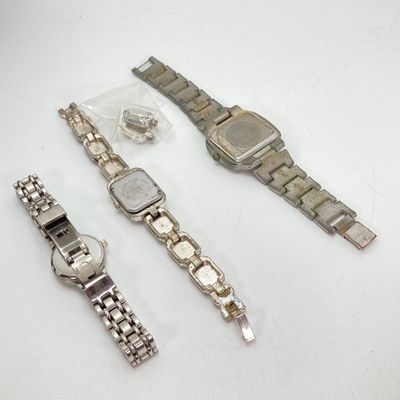 LOT 529: Large Collection of Silver Tone Jewelry - Earrings, Necklaces (Locket with Paper Scroll) and Fashion Watches