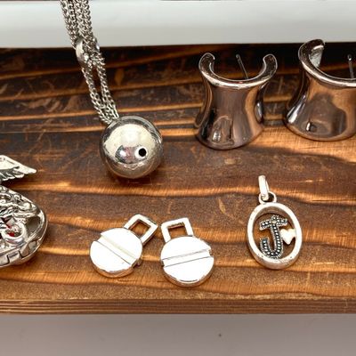 LOT 529: Large Collection of Silver Tone Jewelry - Earrings, Necklaces (Locket with Paper Scroll) and Fashion Watches