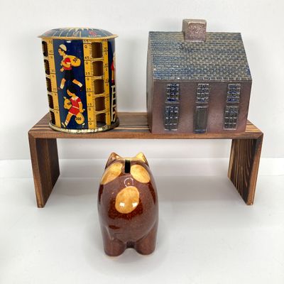 LOT 531: Vintage Coin Bank Collection - Tin Litho Rotary Sorter, Ceramic Cabin, Tin Litho Rotary Sorter, Rexair Vacuum and Piggy Bank