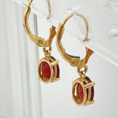 LOT 74: Gold and Garnet Lever Back Pierced Earrings - 14KT, 1.4 GTW