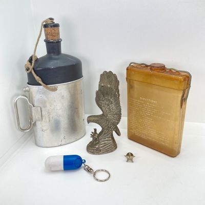 LOT 524: Vintage Military Collection - Survival Kit Plastic Rations Flask, Canteen, Pewter Eagle Figurine and More