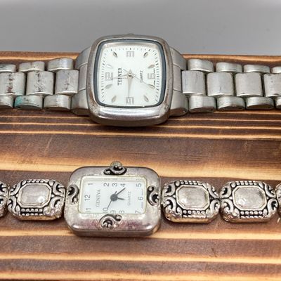 LOT 529: Large Collection of Silver Tone Jewelry - Earrings, Necklaces (Locket with Paper Scroll) and Fashion Watches