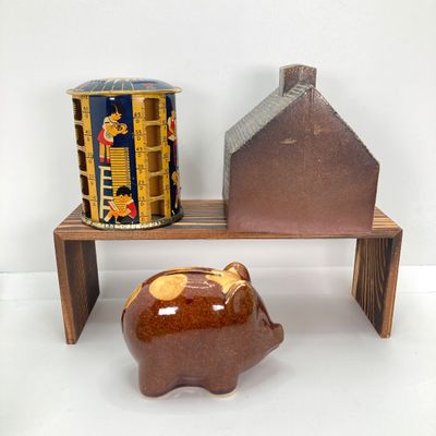 LOT 531: Vintage Coin Bank Collection - Tin Litho Rotary Sorter, Ceramic Cabin, Tin Litho Rotary Sorter, Rexair Vacuum and Piggy Bank