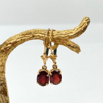 LOT 74: Gold and Garnet Lever Back Pierced Earrings - 14KT, 1.4 GTW