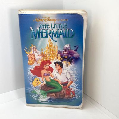LOT 532: Classic Entertainment Collection - "Rick Grimes" Figurine in Original Box, VHS Disney's The Little Mermaid Movie,...