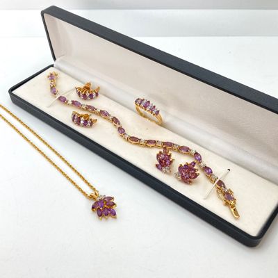 LOT 32: Gold Tone and Purple Stone Jewelry Set - Necklace 18", Ring, Bracelet and Two Pairs of Earrings