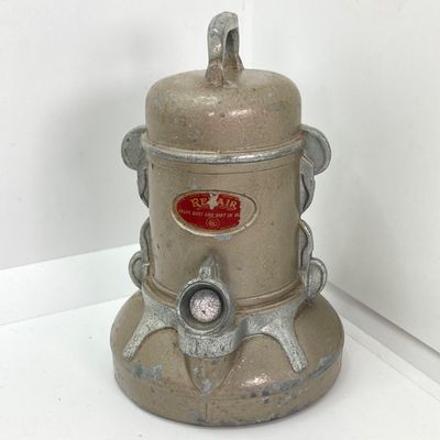 LOT 531: Vintage Coin Bank Collection - Tin Litho Rotary Sorter, Ceramic Cabin, Tin Litho Rotary Sorter, Rexair Vacuum and Piggy Bank