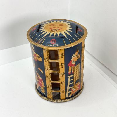 LOT 531: Vintage Coin Bank Collection - Tin Litho Rotary Sorter, Ceramic Cabin, Tin Litho Rotary Sorter, Rexair Vacuum and Piggy Bank