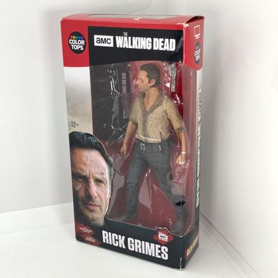 LOT 532: Classic Entertainment Collection - "Rick Grimes" Figurine in Original Box, VHS Disney's The Little Mermaid Movie,...