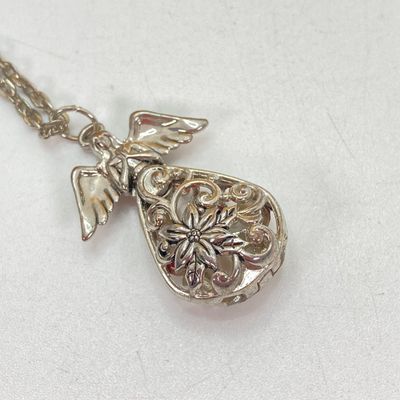 LOT 529: Large Collection of Silver Tone Jewelry - Earrings, Necklaces (Locket with Paper Scroll) and Fashion Watches