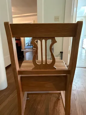 Sale Photo Thumbnail #334: Vintage light oak chair featuring a cutout lyre-back splat design.