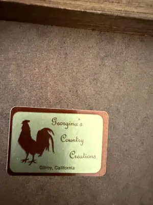 Sale Photo Thumbnail #387: Maker's mark sticker for Georgina's Country Creations of Gilroy, California, featuring a rooster silhouette on the back of a wooden item.