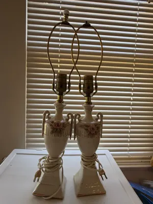 Sale Photo Thumbnail #369: Pair of vintage ivory ceramic urn table lamps featuring applied pink rose accents, double handles, and gold trim.