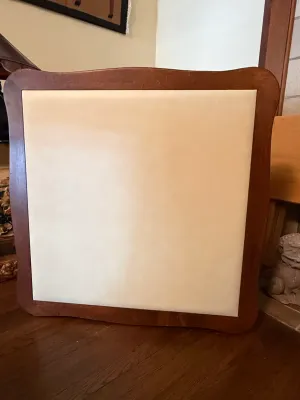 Sale Photo Thumbnail #245: Square wooden card table top featuring a cream-colored inset felt playing surface and smooth finish.