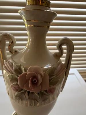 Sale Photo Thumbnail #379: Vintage ceramic urn-style table lamp base featuring gold trim, scroll handles, and applied dimensional pink rose and leaf details.