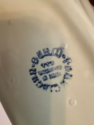Sale Photo Thumbnail #489: Maker's mark on the underside of a vintage ceramic dish, stamped in blue ink indicating 'Made in California, U.S.A.'