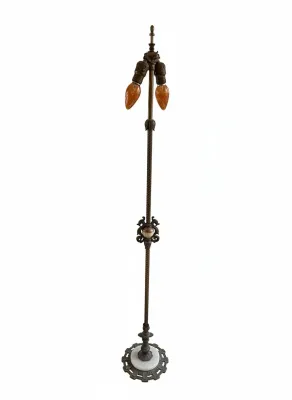Sale Photo Thumbnail #202: Vintage wrought iron bridge floor lamp featuring twisted stem detailing, a marble insert base, and a dual-socket cluster with amber flame light bulbs.