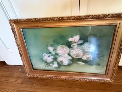 Sale Photo Thumbnail #322: Framed floral still life painting featuring pink and white roses, housed in an ornate carved gilt wood frame.
