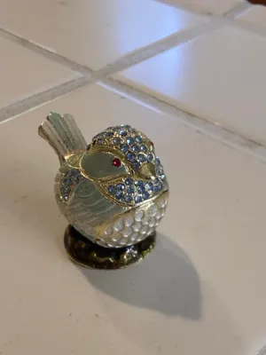 Sale Photo Thumbnail #486: Jeweled enamel bird trinket box, decorated with rhinestones and red glass eyes.